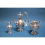 A Mappin & Webb Plated Three Piece Coffee Set, each with foliate decoration, raised on circular