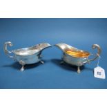 A Pair of Hallmarked Silver Sauce Boats, Menoah Rhodes, London 1924, each with gadrooned edge and