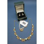 An Edwardian Opal and Pearl Necklace, claw set with nine graduated oval cabochon opals, spaced by
