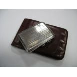 A Hallmarked Silver Cigarette Case, allover engine turned; together with a brown leather cigar case.