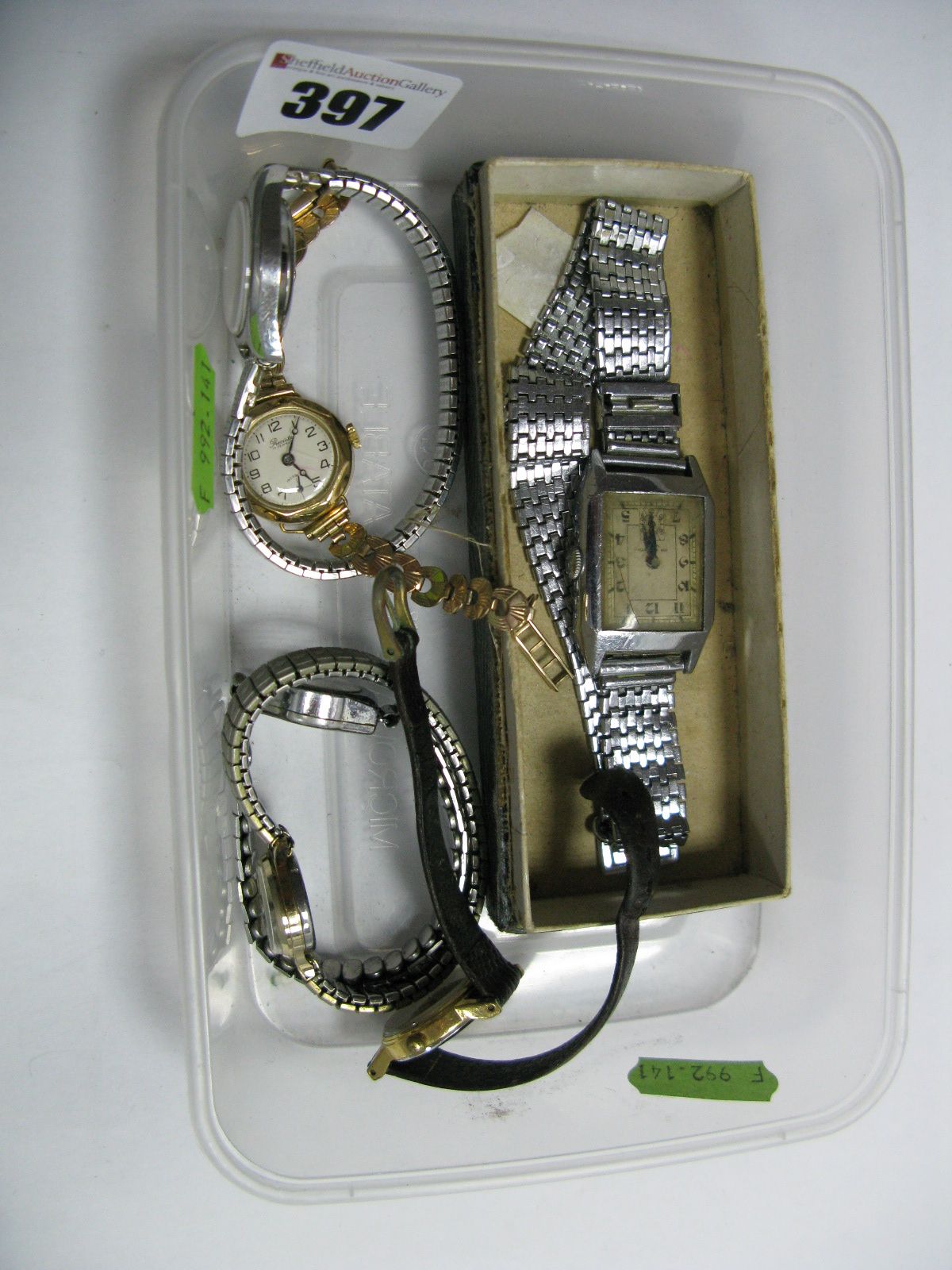 A Lady's Wristwatch, the case stamped "18" ".75", on a fancy link bracelet, with 9ct gold clasp;