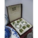 Caverswall Twelve Piece Coffee Service, with holly decoration on green ground in original case.