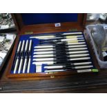 A Mahogany Cased Set of Knives, comprising two sets of twelve and five piece carving set, the box