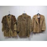 A Mid Brown Fur Jacket, retailed by Joseph Fox Furriers, Sheffield, 66cms long; two further fur