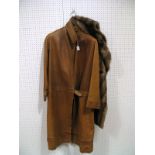 A Vintage Tan Leather Coat, with inset pleat detail to stand-up collar, cuffs and hem. 125cms