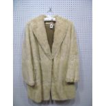 A Cream Fur Coat, three-quarter length, retailed by Mde. Bailey-Styles of Chesterfield, 78cms long.