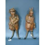 A Pair of Late XIX Century Black Forest Carvings, a hare and a fox, each wearing a jacket, the fox