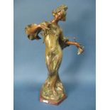 An Art Nouveau Patinated Spelter Figure "Sourire de Printemps Par Flora", the lady wearing a flowing