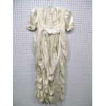 A Mid XX Century Child's Cream Rayon Dress, full length with flounced skirt and pin tucked bodice