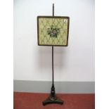 An Early XIX Century Mahogany Pole Screen, with woolwork tapestry panel, on circular stem with