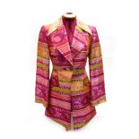 Christian Lacroix Bazar: A Vintage Dress Coat in Aztec type woven fabric in shades of pink, green