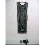 A 1920's Tabard Style Overdress, in black net with black and pale blue beaded design; a contemporary