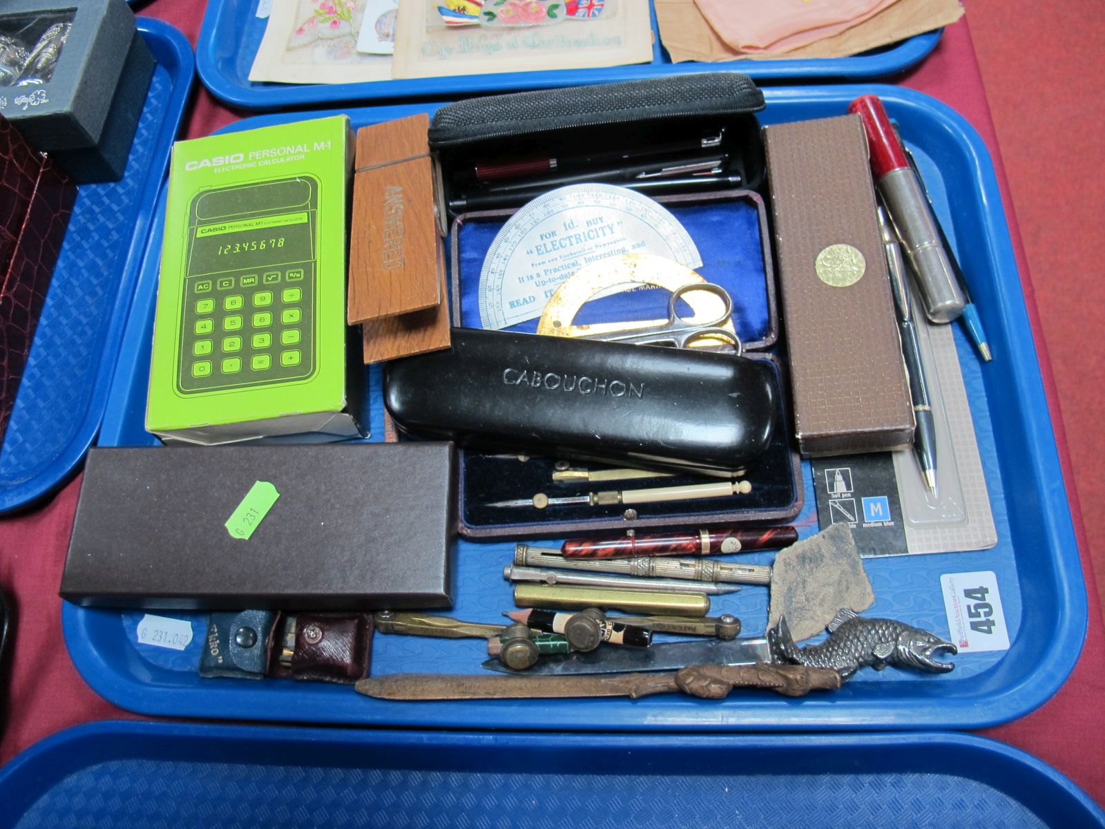 Plated Paper Knife, having fish handle, pencil sharpener, geometry set, Casio calculator, Parker and