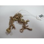 A 9ct Gold Curb Link Bracelet, suspending numerous novelty charm pendants.