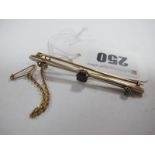 A Diamond Set Bar Brooch, graduated claw set, on tapering bar.