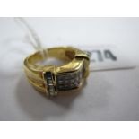A Modern 18ct Gold Princess Cut Diamond Set Ring, of triple row design, rubover set between baguette