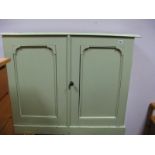 A XIX Century Green Painted Pine Two Door Floor Standing Cupboard, with moulded top on plinth