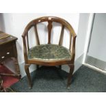 An Early XX Century Mahogany Chair, with rail supports, upholstered seat, on cabriole legs.