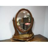 A XIX Century Mahogany Dressing Table Mirror, with an oval mirror, jewel compartment, shaped base,