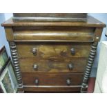 A Victorian Mahogany Four Heights Chest of Drawers, half bobbin turned strips on ball feet.