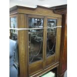 An Edwardian Mahogany Display Cabinet, stepped pediment inlaid with classical swags and pendants,