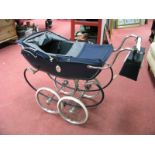 A Mid XX Century Silver Cross Pram, in blue fabric and chrome, with floral oval panels to sides.