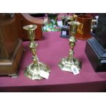 A Pair of XVIII Century Brass Candlesticks, of typical form, raised on octagonal bases, 17cms high.