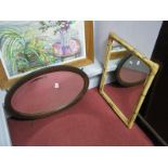 A 1920's Oak Oval Framed Bevelled Wall Mirror. Another in bamboo. (2)