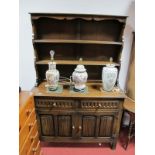 XX Century Dark Oak Dresser Rack, with a panelled back. Two shelves, base with two small drawers,