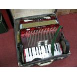 A Hohner Studen VB Piano Accordian, in red pearl effect casing- cased.