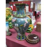 Chinese Cloisonné Urn Shaped Vase, in multicoloured enamels featuring blossoming flowers, on a