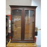 A XIX Century Rosewood Bookcase, moulded cornice, of twin glazed doors, with adjustable shelving,