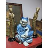 A Pair of Gilded Plaster Chinese Figures, together with a Chinese blue white figure of a seated