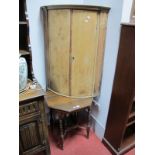 An Early XIX Century Oak Bow Fronted Corner Cupboard, together with an Edwardian octagonal shaped