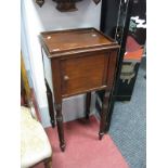 Early XIX Century Mahogany Pot Cupboard, with a galleried top, over a single door on turned legs.