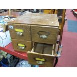 Oak Four Drawer Filing Cabinet, with brass cup handles.