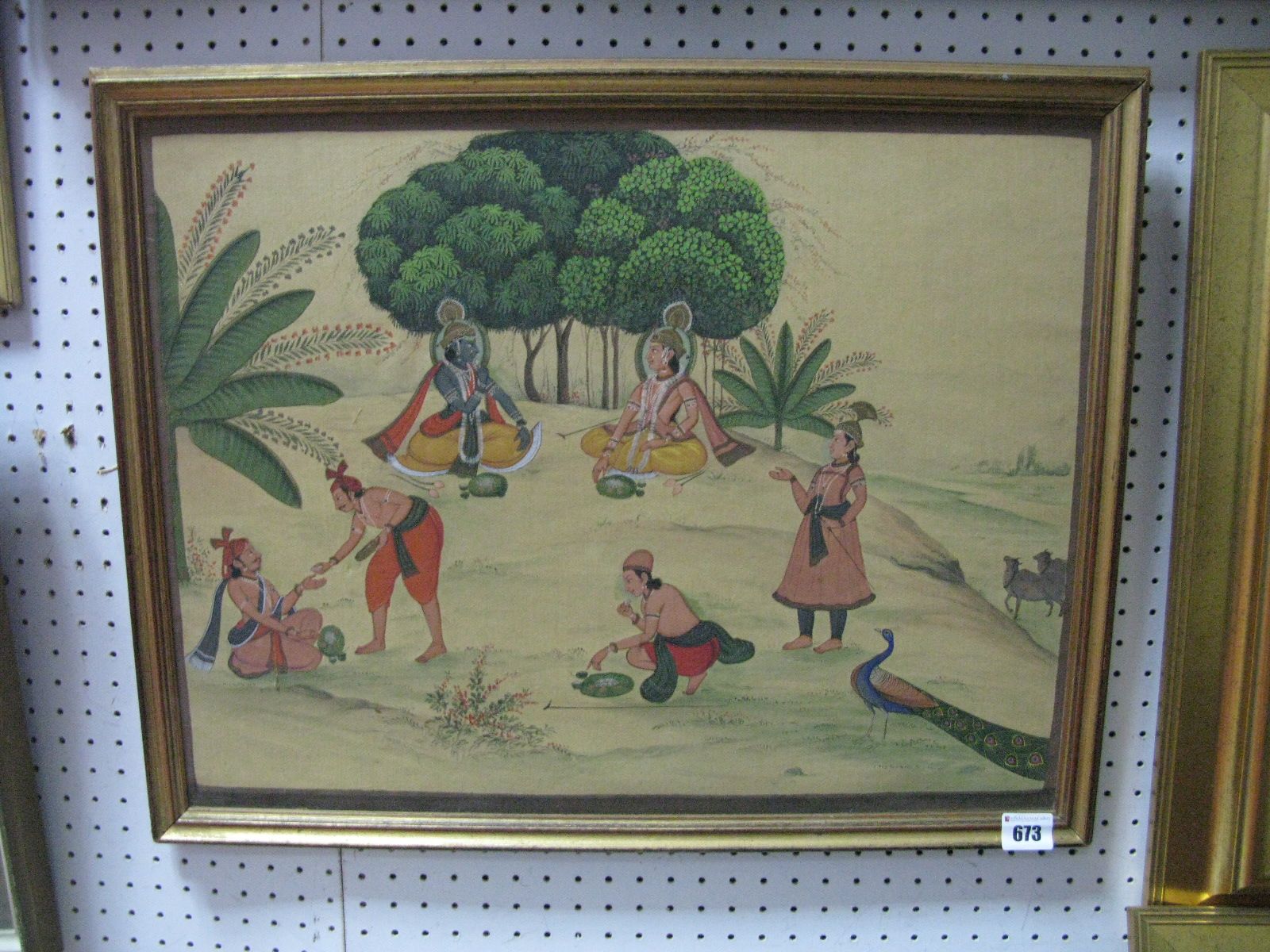 Indian Watercolour on Silk, circa 1900, featuring tea drinking figures in meadow with peacock and