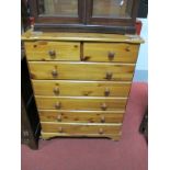 A Pine Chest of Drawers, with two small drawers, five long drawers, on bracket feet.