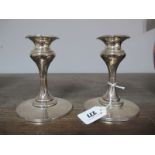 A Pair of Hallmarked Silver Candlesticks, (marks rubbed) each on wide spreading circular base,