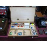 Quantity of Feathers, cottons, varnish, etc., in wooden box.