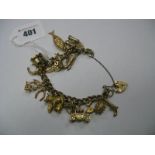 A 9ct Gold Curb Link Charm Bracelet, suspending numerous novelty charm pendants, including