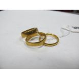 Two 22ct Gold Plain Wedding Bands, together with another plain wedding band. (3)