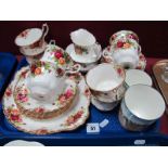 A Royal Albert 'Old Country Roses' tea service (24 pieces), and a Royal Doulton series ware beaker