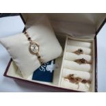 A 9ct Gold Lady's Wristwatch, to inset bracelet, together with two 9ct gold cluster dress rings, and