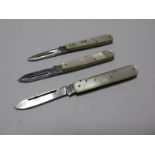 Three Single L.R. Pratt Single Blade Folding Knives, each stamped "Patent No. 292242", with mother