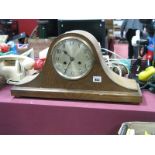 An Oak Veneered Mantle Clock, arched Napoleon hat case, silvered dial, black Arabic numerals on