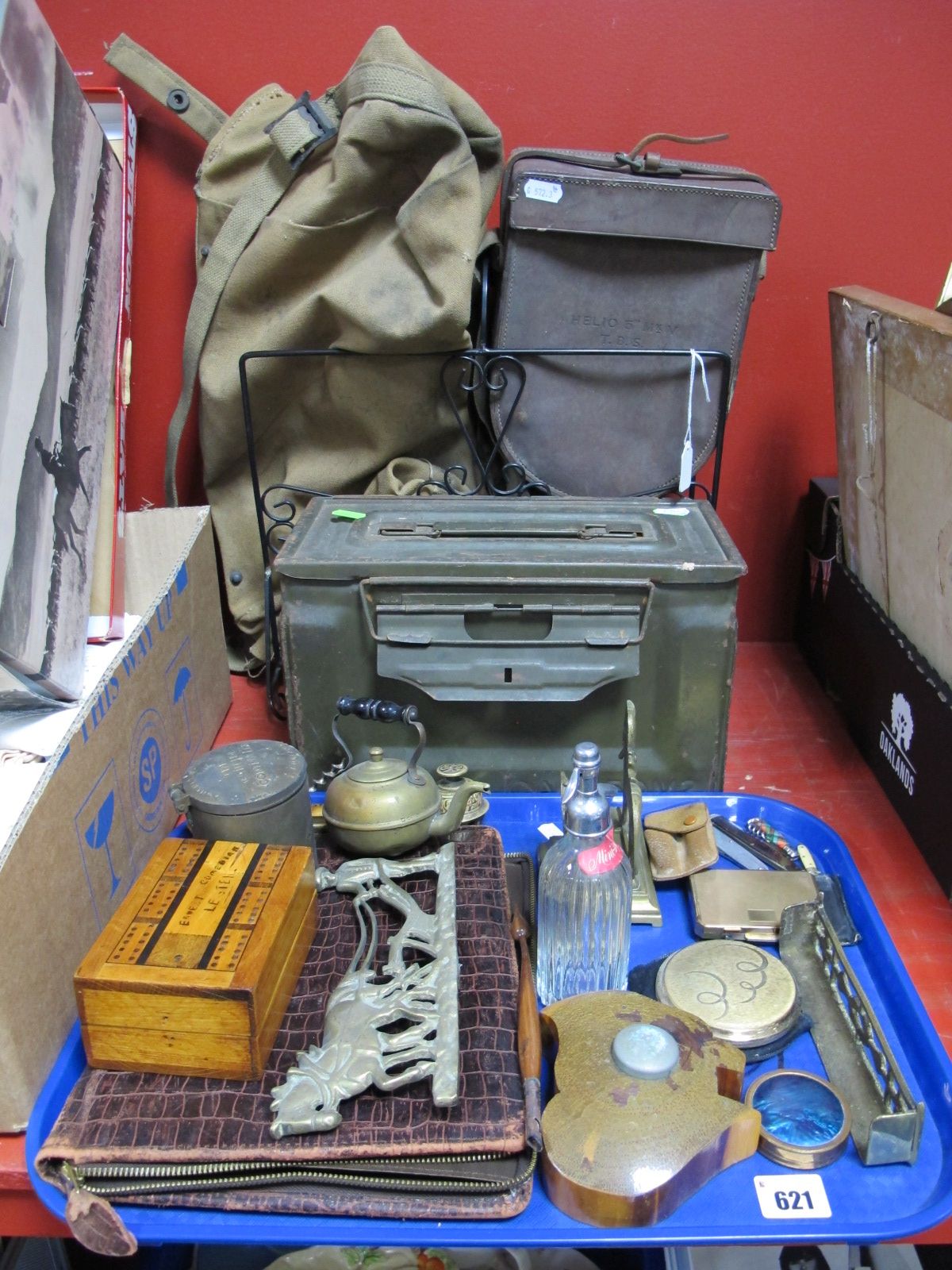 An Ammo Tin, military stitched leather case, a gunfire controller,m together with miniature soda