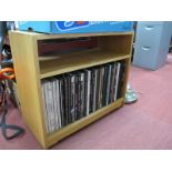 Quantity of Thirty Three RPM Records, in lightwood cabinet.