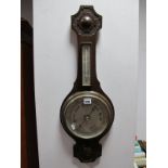 An Early XX Century Oak Anoroid Barometer, early XX century brass render, and a mahogany coal