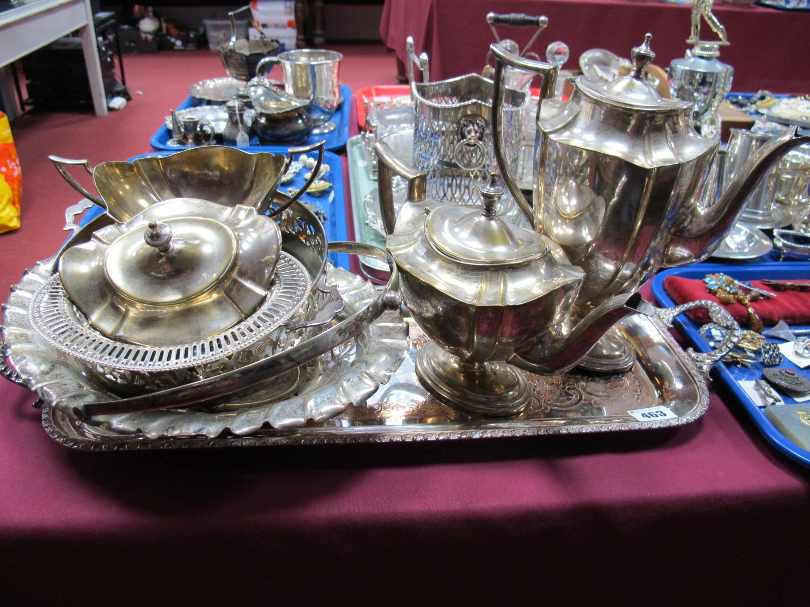 An Oval Plated Three Piece Tea Service, pierced basket and bonbon dish, casserole holder,